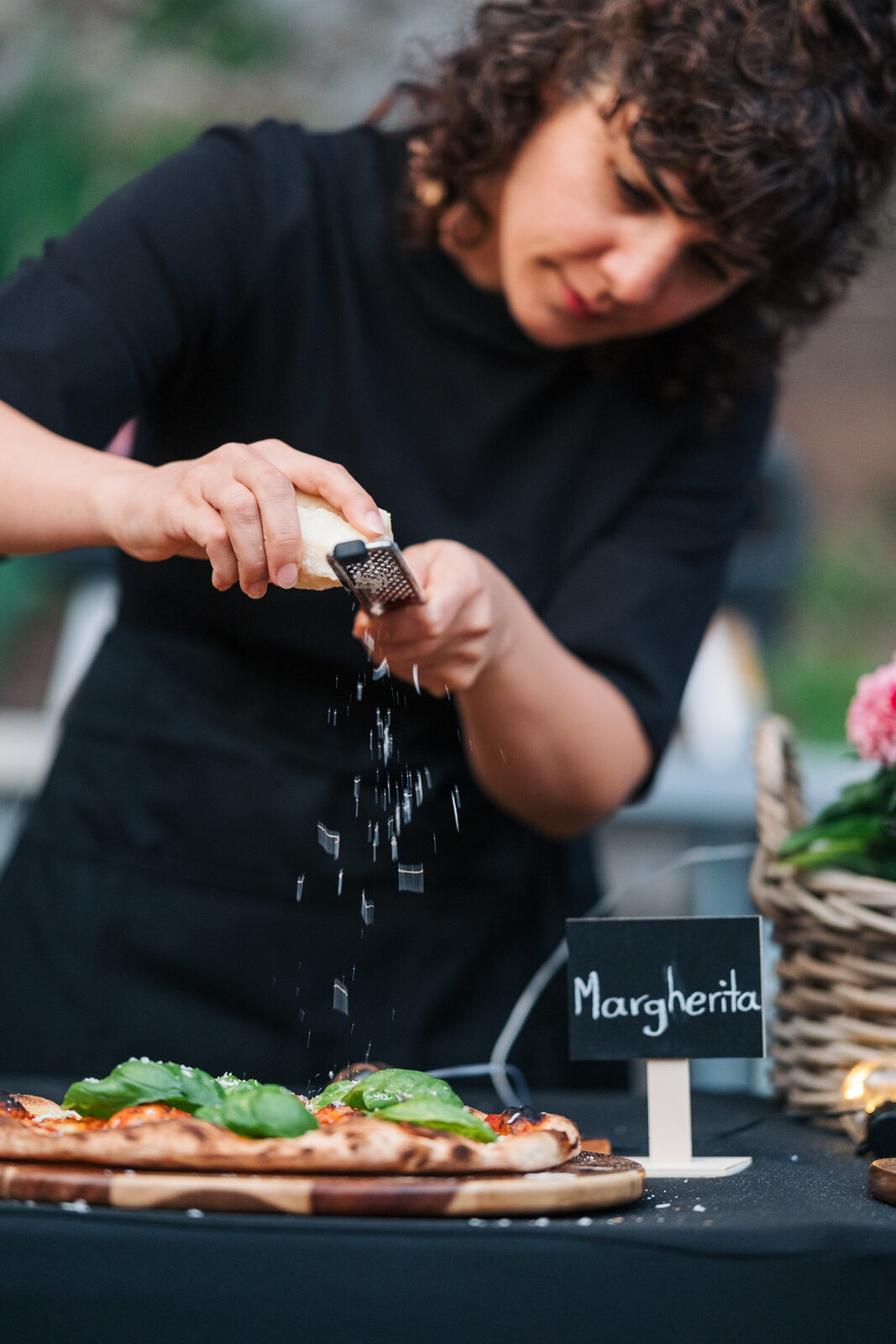 table one. catering team preparing pizza at a private event in Vancouver
