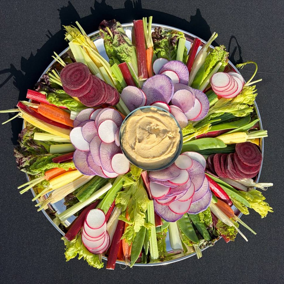 Fresh seasonal vegetable crudité platter with house-made hummus — table one. catering Vancouver
